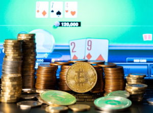 bitcoin crypto and other money in the foreground online game of poker in background