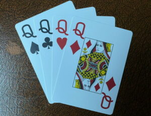 four queen playing cards different suits