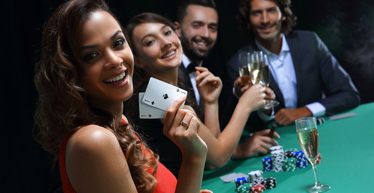 group of people playing blackjack