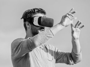 man with vr headset gesticulating