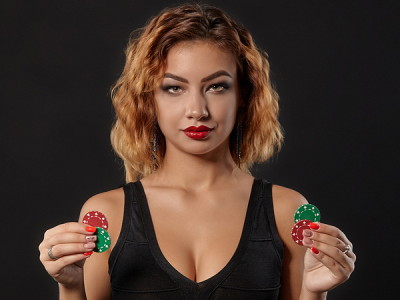 woman holding casino chips